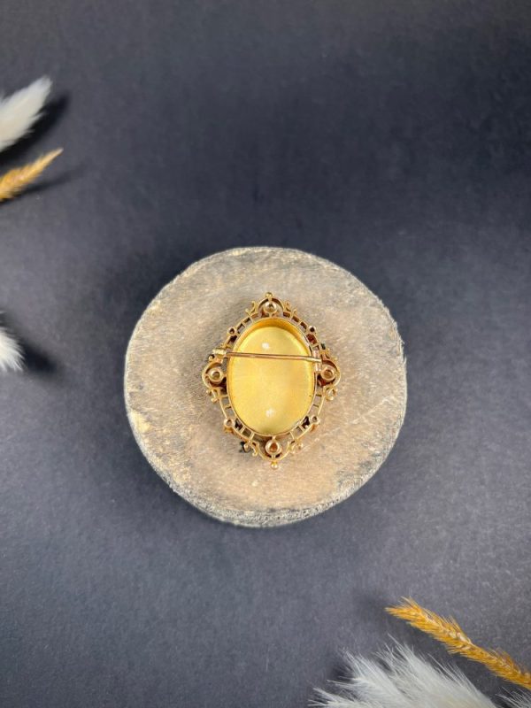 Antique enamel, pearl and diamond portrait brooch in gold.