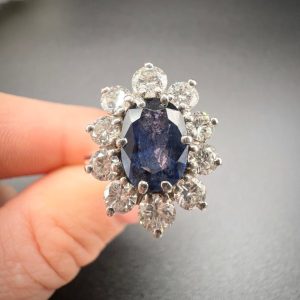 Sapphire and diamond cluster ring in white gold.