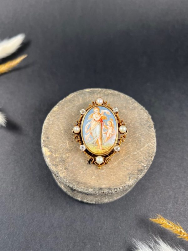 Antique enamel, pearl and diamond portrait brooch in gold.