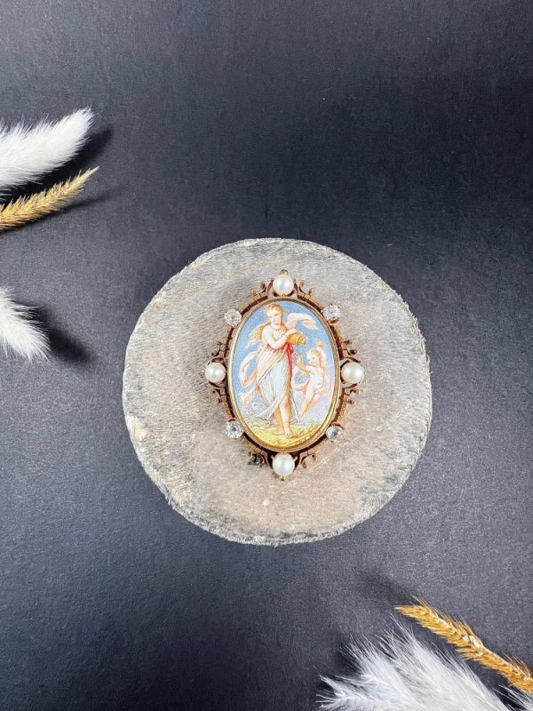 Antique enamel, pearl and diamond portrait brooch in gold.