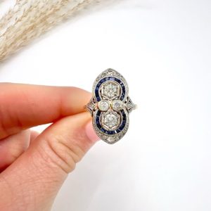 Art Deco diamond and sapphire ring in platinum and gold.