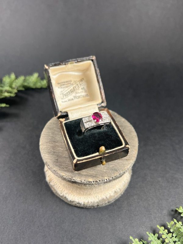 Vintage diamond and ruby cocktail ring in white gold.