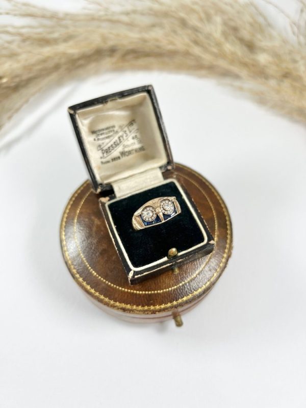 Vintage owl cocktail ring in rose gold with diamonds and sapphires.