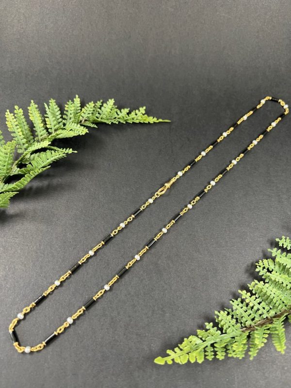 Victorian enamel and pearl long necklace in gold,.