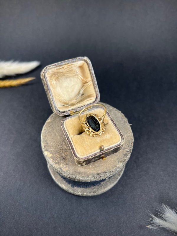 Antique sapphire and diamond cluster ring in gold and platinum.