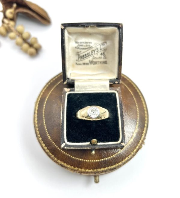 Antique gold gypsy band ring with single diamond.
