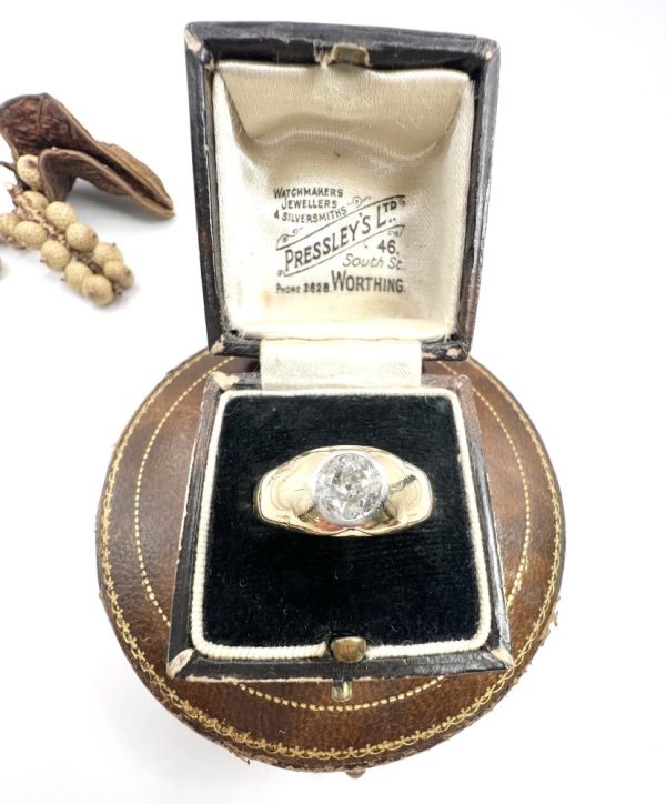 Antique gold gypsy band ring with single diamond.