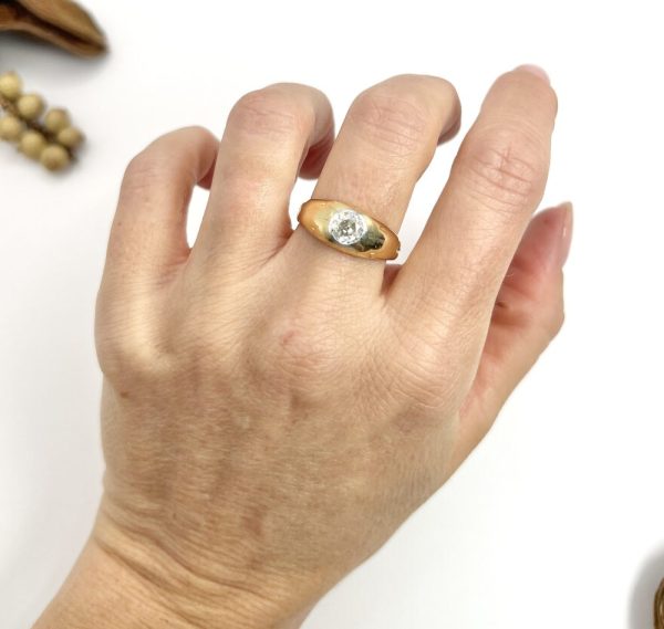 Antique gold gypsy band ring with single diamond.
