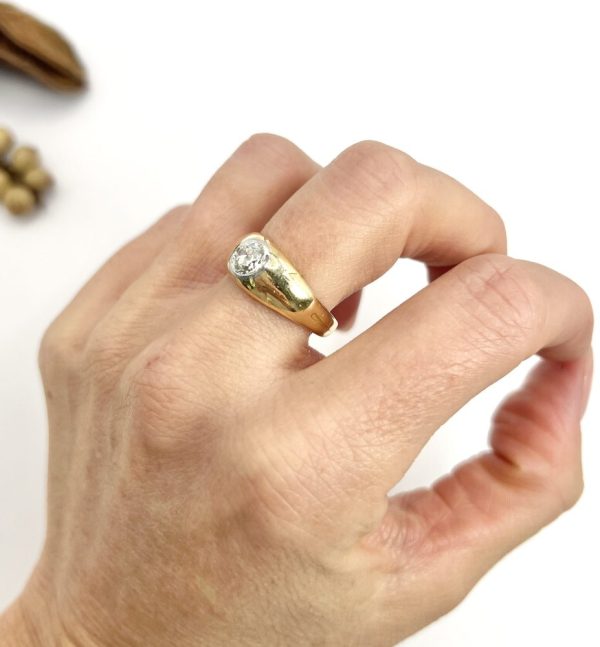 Antique gold gypsy band ring with single diamond.