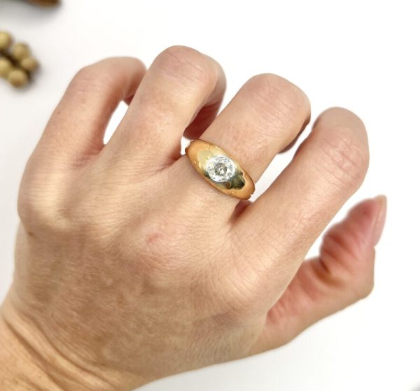 Antique gold gypsy band ring with single diamond.