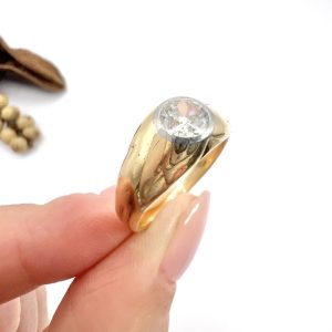 Antique gold gypsy band ring with single diamond.