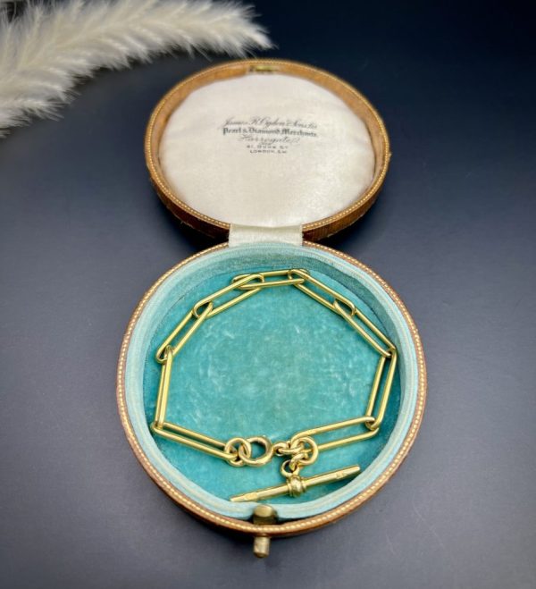 Edwardian trombone link bracelet in gold.