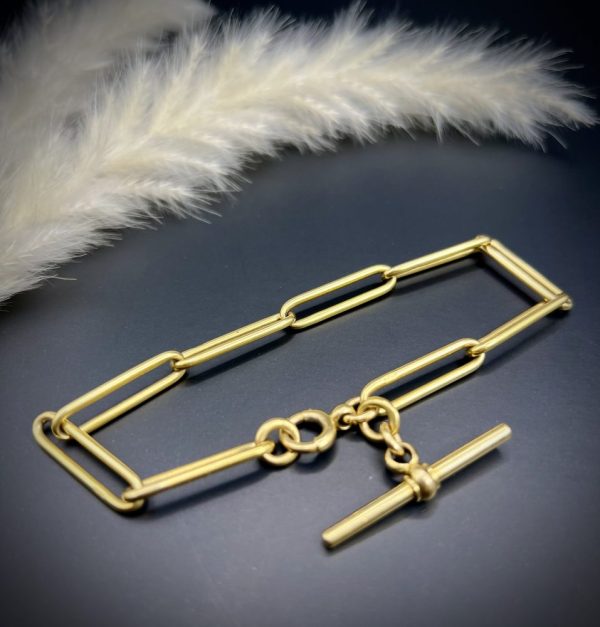 Edwardian trombone link bracelet in gold.