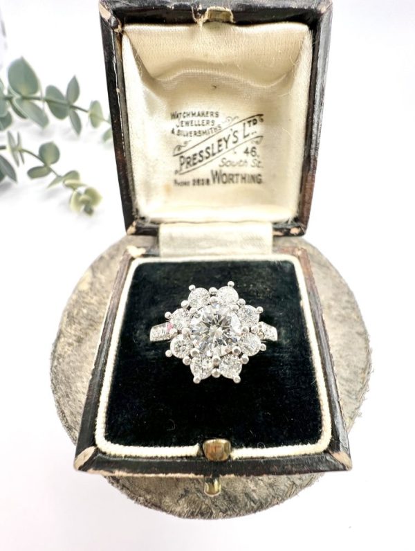 Diamond daisy cluster ring in platinum.