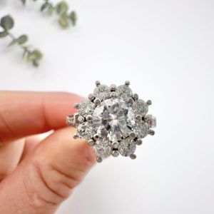 Diamond daisy cluster ring in platinum.