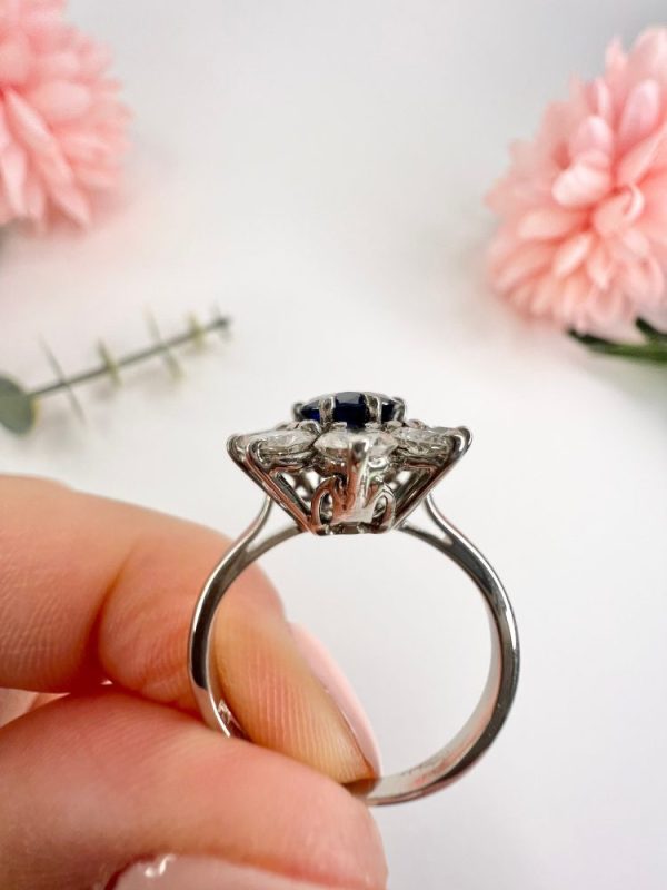 Sapphire and diamond cluster ring in white gold.