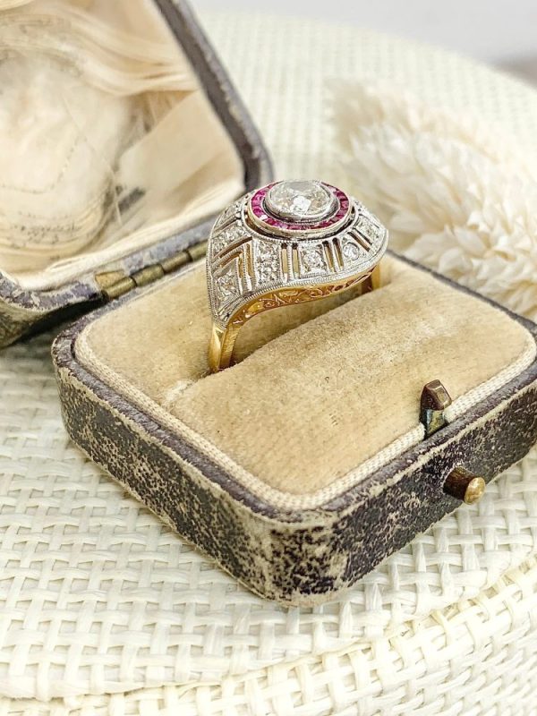 Art Deco diamond and ruby target ring in yellow and white gold.