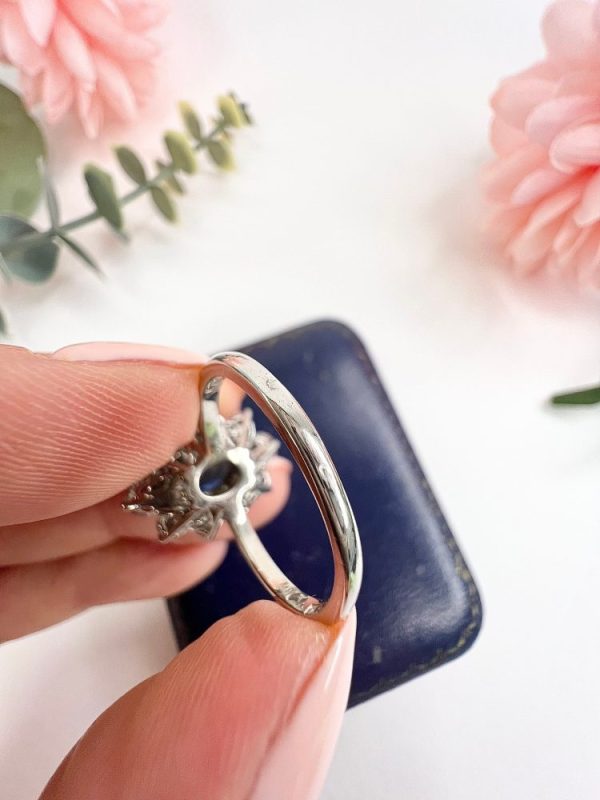Sapphire and diamond cluster ring in white gold.