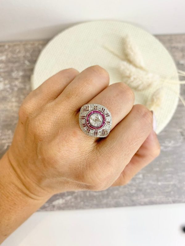 Art Deco diamond and ruby target ring in yellow and white gold.