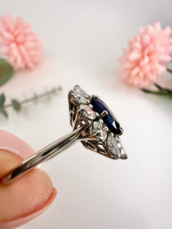 Sapphire and diamond cluster ring in white gold.