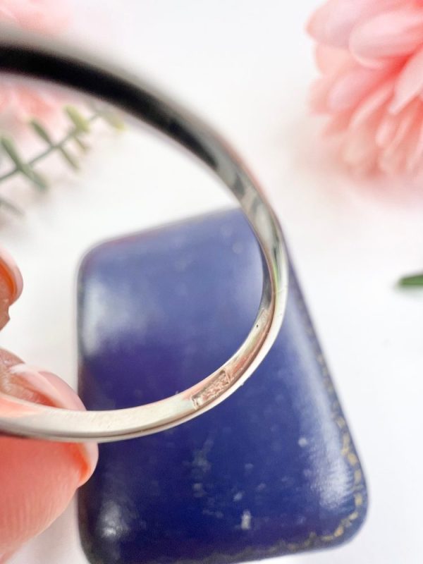 Sapphire and diamond cluster ring in white gold.