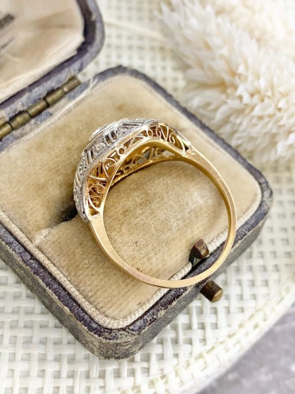 Art Deco diamond and ruby target ring in yellow and white gold.