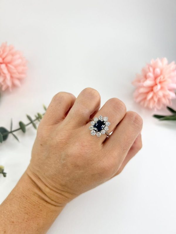 Sapphire and diamond cluster ring in white gold.