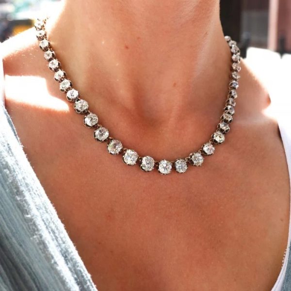 Victorian Antique 40cts Old Cut Diamond Line Riviere Necklace, 54 old-cut diamonds totalling 40 carats in silver-upon-gold crown claw settings. Late 19th century Circa 1880
