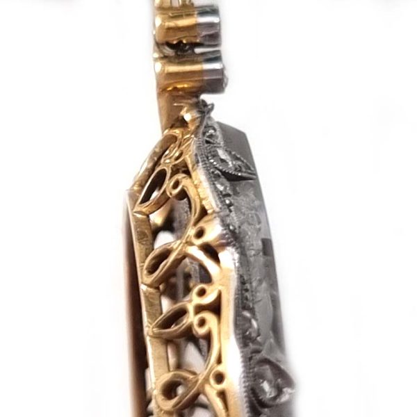 Antique Onyx and Rock Crystal Intaglio Pendant on Seed Pearl Sautoir Necklace, long geometric strung seed pearls suspends oval black onyx and rock crystal intaglio pendant featuring two winged cherubs holding aloft  flowers in an urn