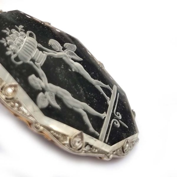 Antique Onyx and Rock Crystal Intaglio Pendant on Seed Pearl Sautoir Necklace, long geometric strung seed pearls suspends oval black onyx and rock crystal intaglio pendant featuring two winged cherubs holding aloft  flowers in an urn