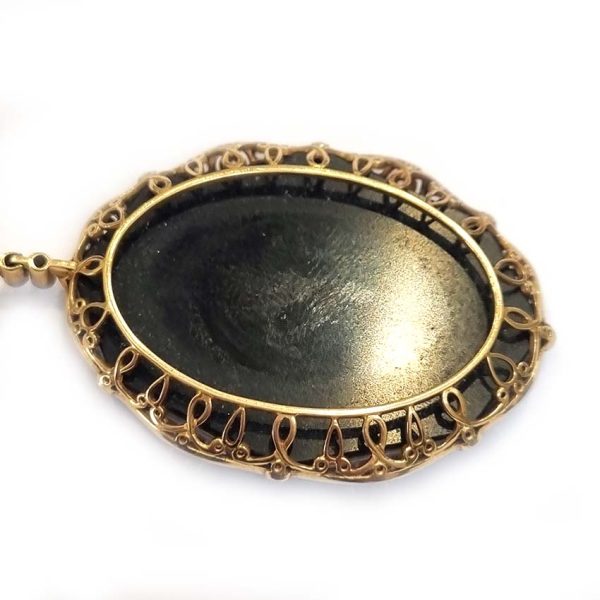 Antique Onyx and Rock Crystal Intaglio Pendant on Seed Pearl Sautoir Necklace, long geometric strung seed pearls suspends oval black onyx and rock crystal intaglio pendant featuring two winged cherubs holding aloft  flowers in an urn