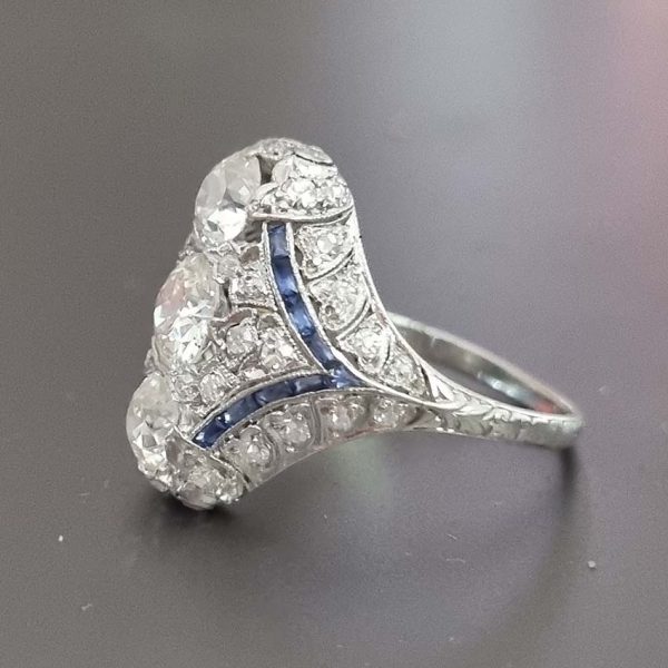 Antique Art Deco Edwardian diamond and Sapphire dinner ring, the eye catching cocktail ring set with old cut diamonds in platinum, milliegrain setting 1920s