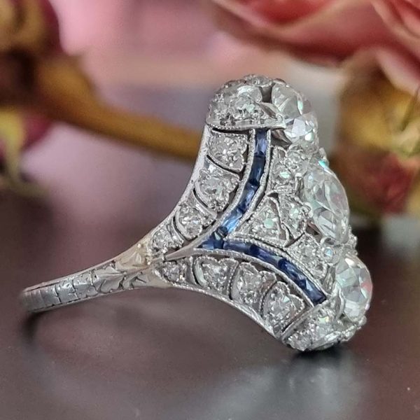 Antique Art Deco Edwardian diamond and Sapphire dinner ring, the eye catching cocktail ring set with old cut diamonds in platinum, millegrain setting 1920s