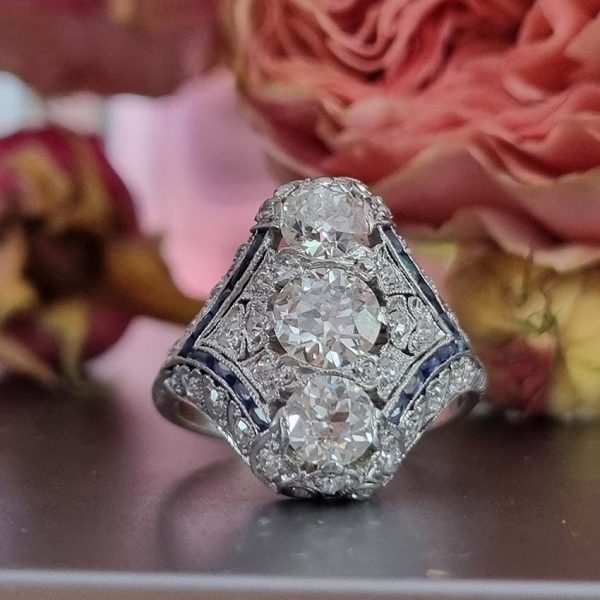 Antique Art Deco Edwardian diamond and Sapphire dinner ring, the eye catching cocktail ring set with old cut diamonds in platinum, milliegrain setting 1920s