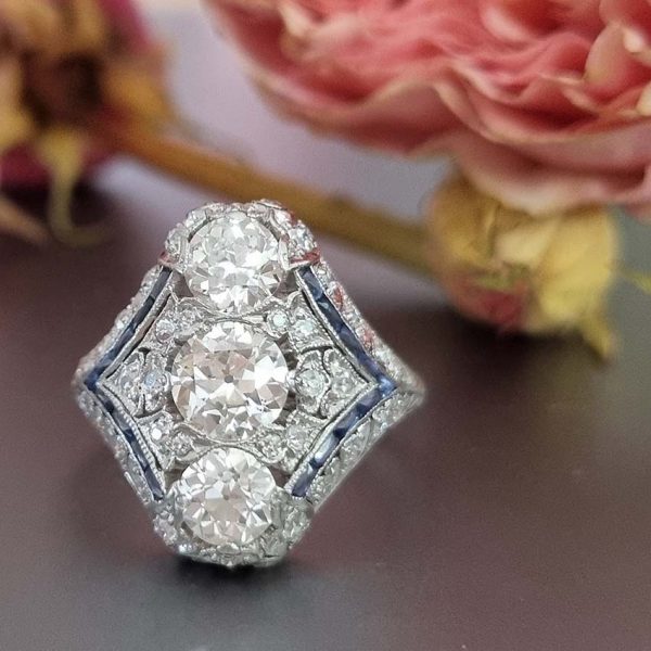 Antique Art Deco Edwardian diamond and Sapphire dinner ring, the eye catching cocktail ring set with old cut diamonds in platinum, milliegrain setting 1920s