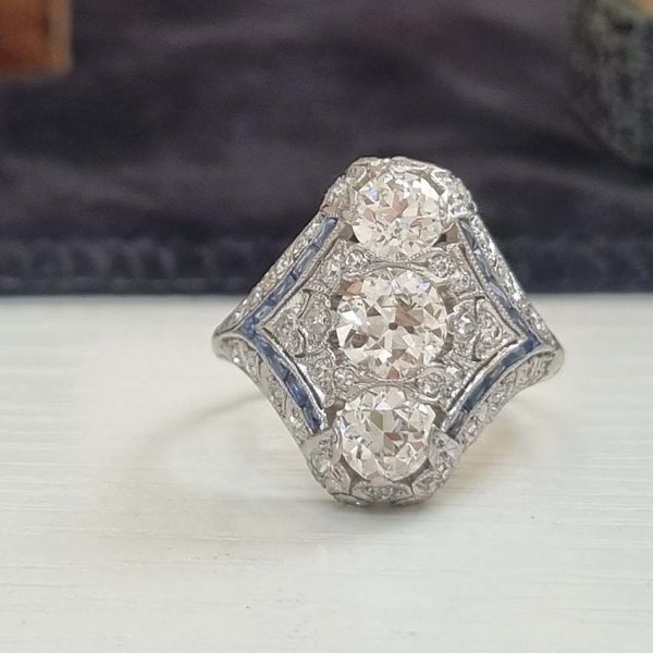 Antique Art Deco Edwardian diamond and Sapphire dinner ring, the eye catching cocktail ring set with old cut diamonds in platinum, millegrain setting 1920s