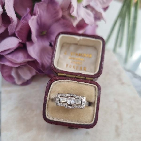 Art Deco 1.20ct Asscher and Baguette Diamond Cluster Ring, asscher diamond flanked by landscape baguette diamonds within border of old-cut diamonds in platinum. Circa 1930s
