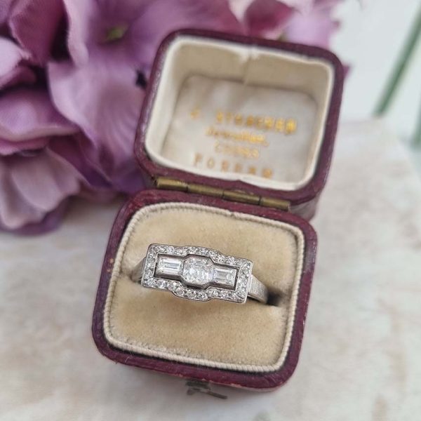 Art Deco 1.20ct Asscher and Baguette Diamond Cluster Ring, asscher diamond flanked by landscape baguette diamonds within border of old-cut diamonds in platinum. Circa 1930s