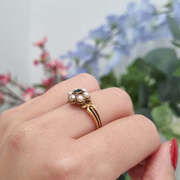 Georgian Antique Emerald and Pearl Cluster Ring, emerald surrounded by pearls in timeless floral cluster design in yellow gold accented with scrolled shoulders and gold granule detailing and locket compartment to reverse