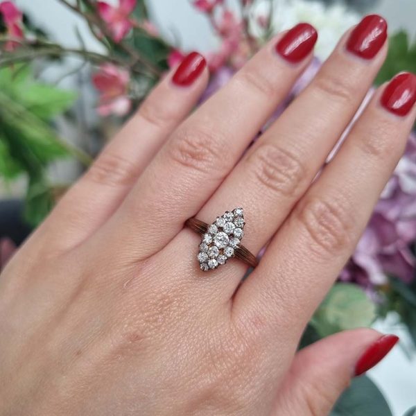 Victorian Antique Old Cut Diamond Navette Cluster Ring, composed of old mine-cut diamond arranged in an eye-catching navette shaped cluster in silver upon yellow gold. Circa 1860.