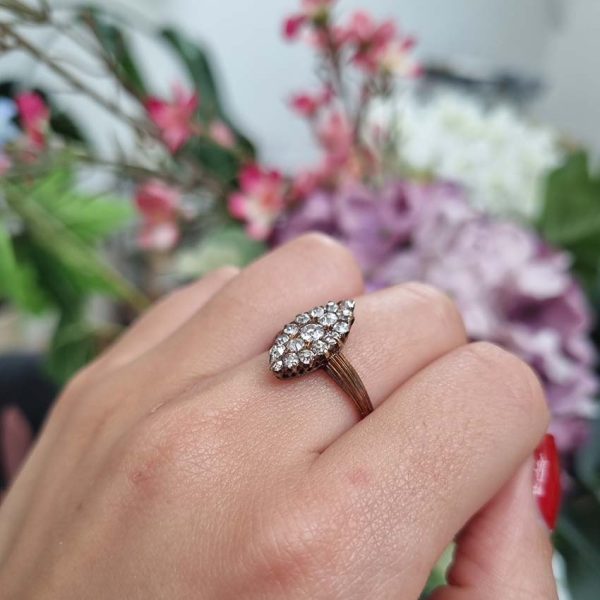 Victorian Antique Old Cut Diamond Navette Cluster Ring, composed of old mine-cut diamond arranged in an eye-catching navette shaped cluster in silver upon yellow gold. Circa 1860.