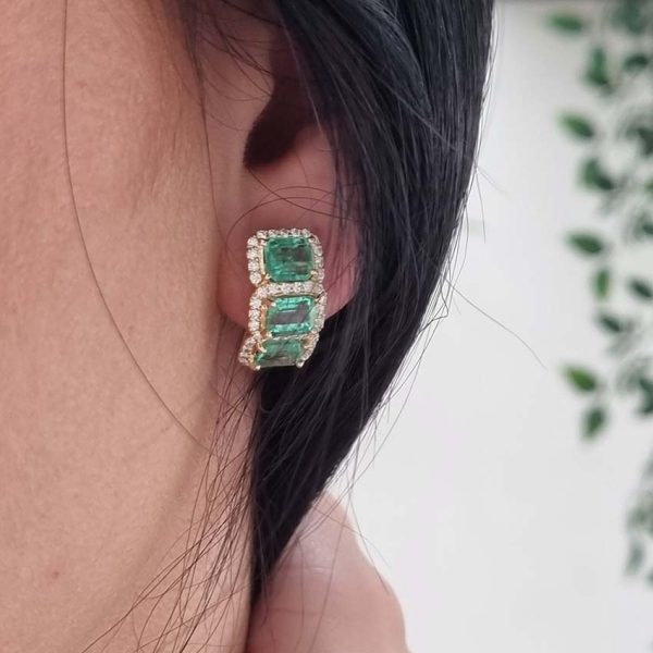 3.50ct Emerald and Diamond Cluster Half Hoop Huggie Earrings in 18ct Yellow Gold, three emerald-cut emeralds set horizontally in a line surrounded by sparkling diamonds