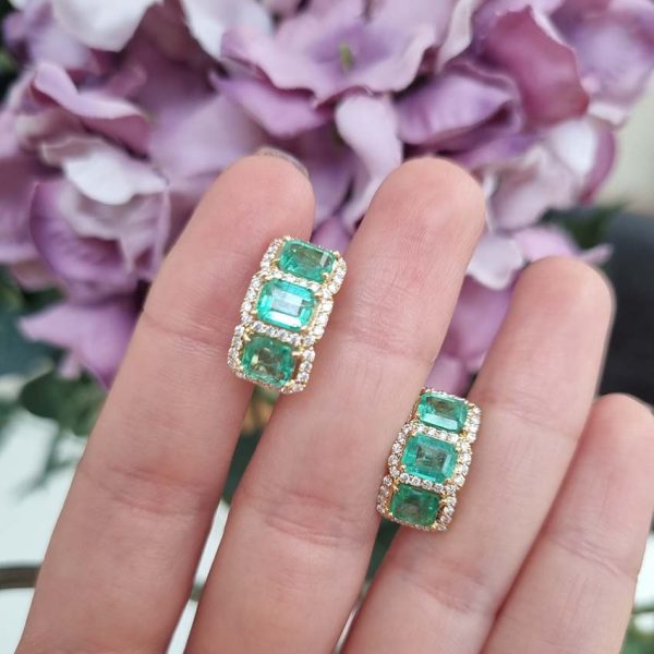 3.50ct Emerald and Diamond Cluster Half Hoop Huggie Earrings in 18ct Yellow Gold, three emerald-cut emeralds set horizontally in a line surrounded by sparkling diamonds