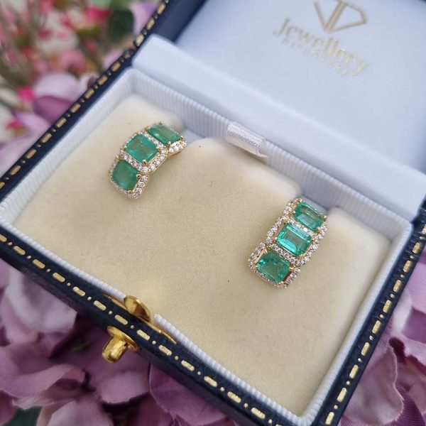 3.50ct Emerald and Diamond Cluster Half Hoop Huggie Earrings in 18ct Yellow Gold, three emerald-cut emeralds set horizontally in a line surrounded by sparkling diamonds