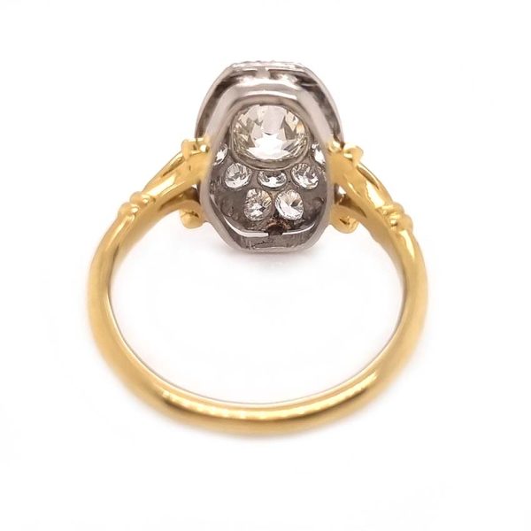 Antique Cushion Old Cut Diamond Cluster Plaque Tablet Ring, 1.08ct cushion-shaped old-cut diamond surrounded by 1.23cts old mine-cut diamonds in platinum to 18ct yellow gold, 2.31 carat total