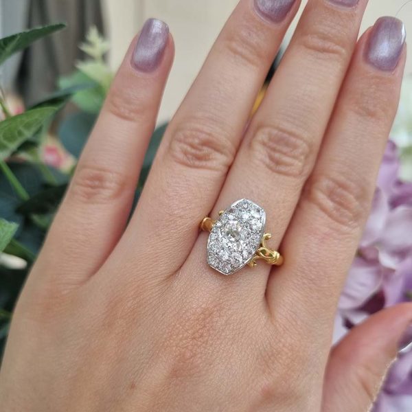 Antique Cushion Old Cut Diamond Cluster Plaque Tablet Ring, 1.08ct cushion-shaped old-cut diamond surrounded by 1.23cts old mine-cut diamonds in platinum to 18ct yellow gold, 2.31 carat total