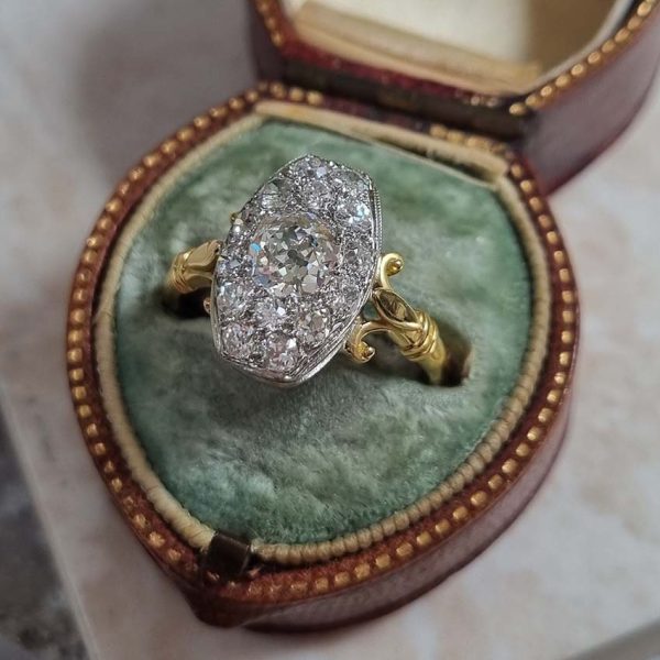 Antique Cushion Old Cut Diamond Cluster Plaque Tablet Ring, 1.08ct cushion-shaped old-cut diamond surrounded by 1.23cts old mine-cut diamonds in platinum to 18ct yellow gold, 2.31 carat total