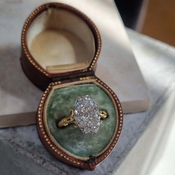 Antique Cushion Old Cut Diamond Cluster Plaque Tablet Ring, 1.08ct cushion-shaped old-cut diamond surrounded by 1.23cts old mine-cut diamonds in platinum to 18ct yellow gold, 2.31 carat total