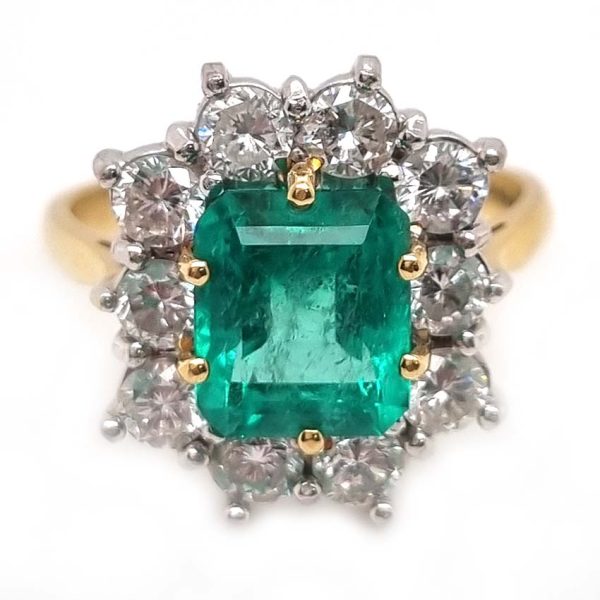 Vintage 2.91ct Emerald and Diamond Cluster Engagement Ring, 2.91ct emerald-cut emerald surrounded by 1.50 carats of sparkling round brilliant-cut diamonds in 18ct yellow gold