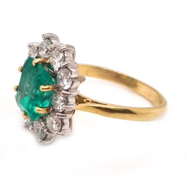 Vintage 2.91ct Emerald and Diamond Cluster Engagement Ring, 2.91ct emerald-cut emerald surrounded by 1.50 carats of sparkling round brilliant-cut diamonds in 18ct yellow gold